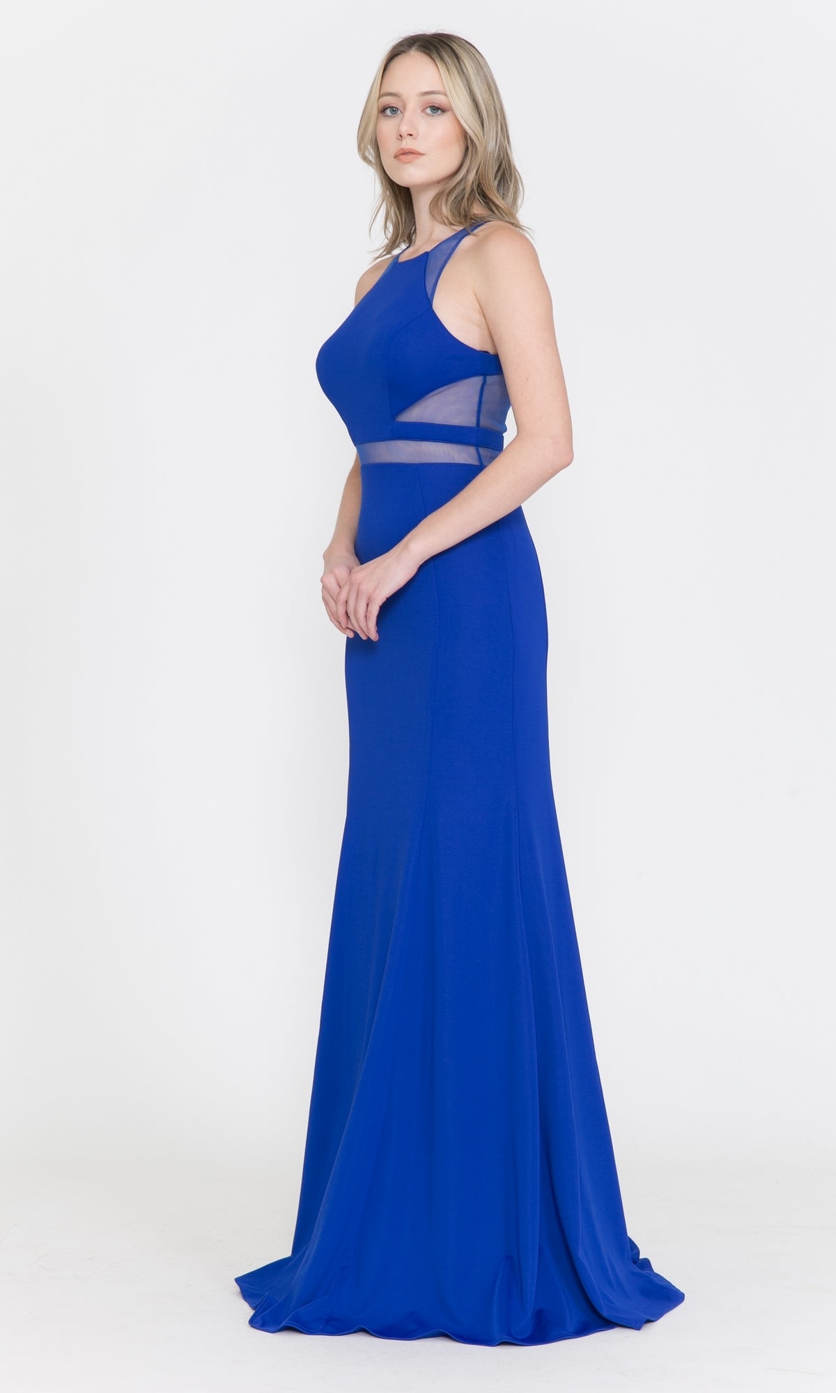 A woman models the Illusion-Cut-Out High-Neck Long Prom Dress 8054 in royal blue, featuring sleeveless design and sheer mesh waist panels, standing against a plain white background.
